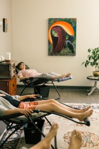 people in reclining chairs, peacefully napping