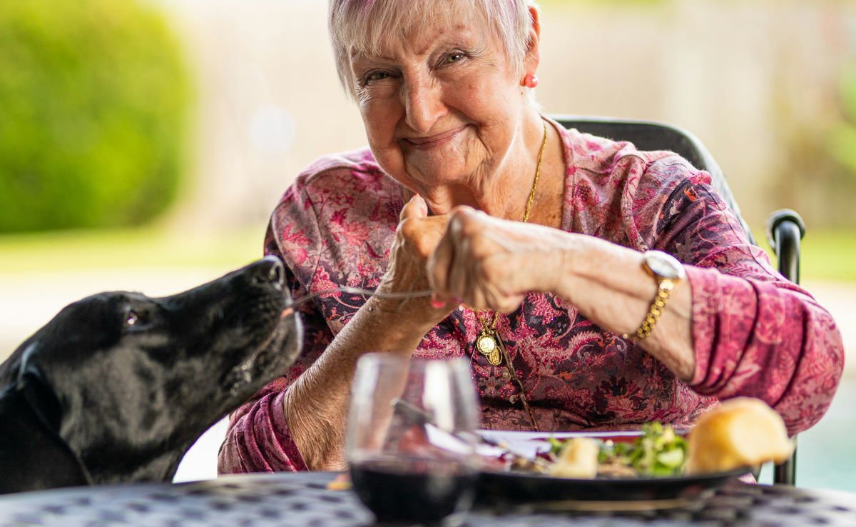 elderly woman and her dog
